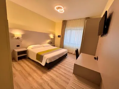 Letto o letti in una camera di Hotel Aurora