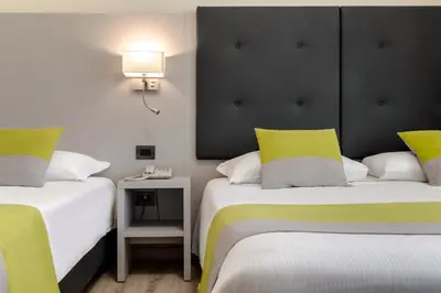 Letto o letti in una camera di Hotel Aurora