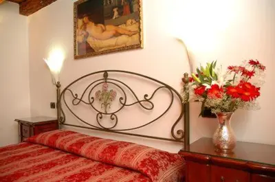 Letto o letti in una camera di Ca' Dei Leoni