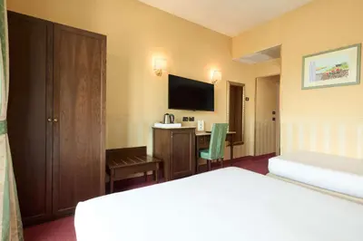 Letto o letti in una camera di Best Western Hotel Tritone