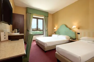 Letto o letti in una camera di Best Western Hotel Tritone