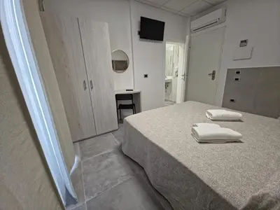 Letto o letti in una camera di Hotel Villa Reale