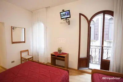 Letto o letti in una camera di Hotel Caprera