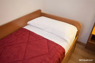 Letto o letti in una camera di Hotel Caprera
