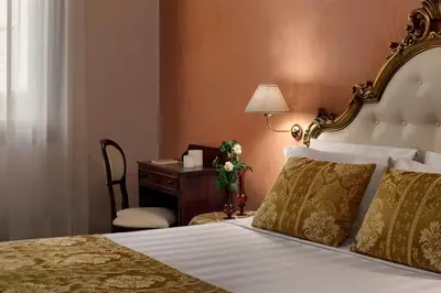 Letto o letti in una camera di Hotel Pausania