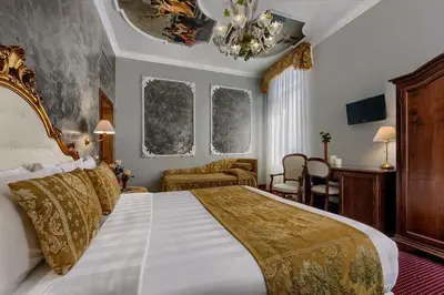 Letto o letti in una camera di Hotel Pausania