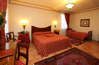 Letto o letti in una camera di Park Hotel Villa Fiorita