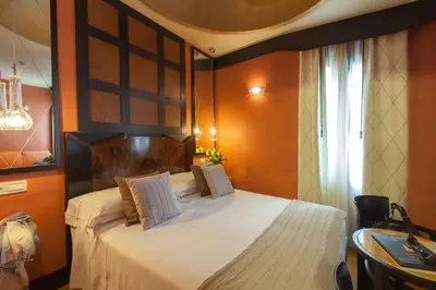 Letto o letti in una camera di Hotel Saturnia & International