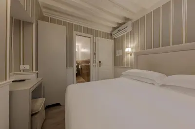 Letto o letti in una camera di Hotel Bartolomeo