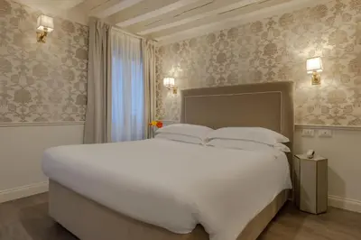 Letto o letti in una camera di Hotel Bartolomeo