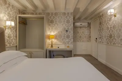 Letto o letti in una camera di Hotel Bartolomeo