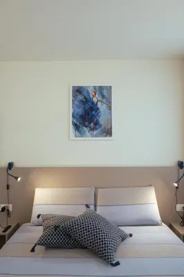 Letto o letti in una camera di Residenza SubitoSanto 