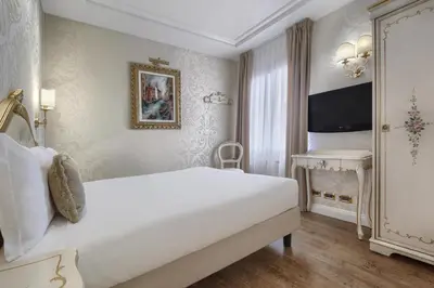 Letto o letti in una camera di Hotel Olimpia Venice, BW Signature Collection 3sup