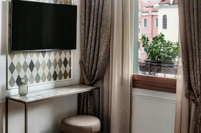 TV o dispositivi per l'intrattenimento presso Hotel Arlecchino