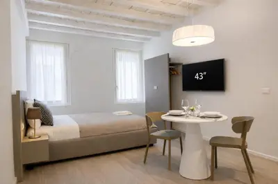 Letto o letti in una camera di Residenza SubitoSanto - Appartamento 6A 