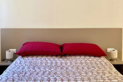 Letto o letti in una camera di Residenza SubitoSanto - Appartamento 4A 