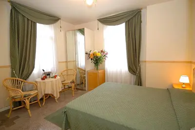 Letto o letti in una camera di Villa Angelica