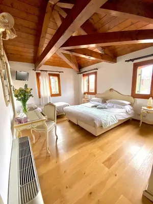 Letto o letti in una camera di Alloggi Ai Tessitori