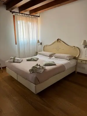 Letto o letti in una camera di Alloggi Ai Tessitori