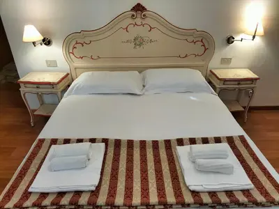 Letto o letti in una camera di RIALTO EXPERIENCE