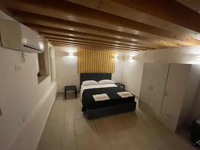 Letto o letti in una camera di Dimora Blu Suite