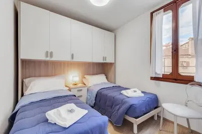 Letto o letti in una camera di Piazza San Marco Cozy Apartment x4