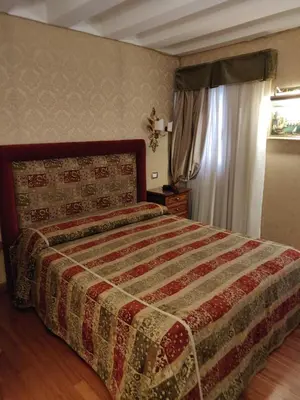 Letto o letti in una camera di Hotel Ca' Marinella