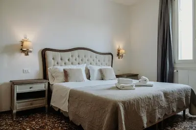 Letto o letti in una camera di Palazzetto Barnaba