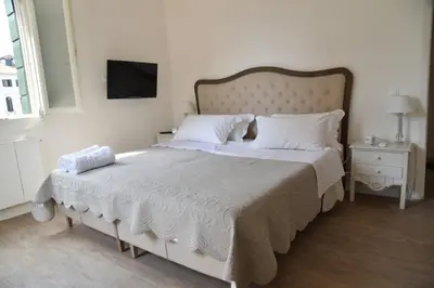Letto o letti in una camera di Palazzetto Barnaba