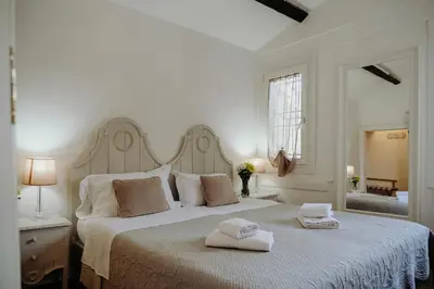Letto o letti in una camera di Palazzetto Barnaba