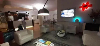 TV o dispositivi per l'intrattenimento presso Momi's Hotel