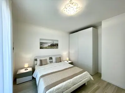 Letto o letti in una camera di C Palace - Carraro Immobiliare - Family Apartments