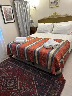 Letto o letti in una camera di Familly rooms (two rooms) Cà del Traghetto
