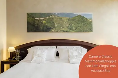 Letto o letti in una camera di Wine Hotel San Giacomo Activity & Wellness