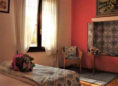 Letto o letti in una camera di Relais Alcova del Doge