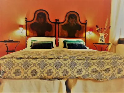 Letto o letti in una camera di Relais Alcova del Doge