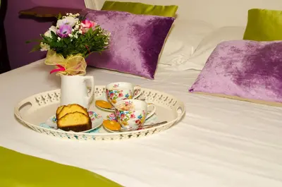 Letto o letti in una camera di Relais Alcova del Doge