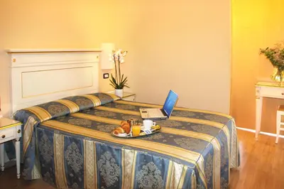 Letto o letti in una camera di Hotel Regit