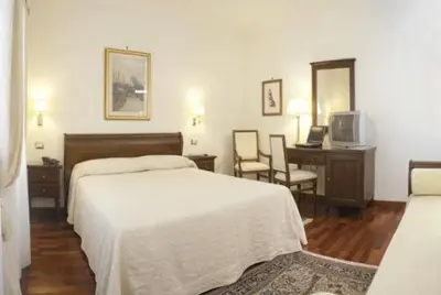Letto o letti in una camera di Villa Crispi