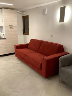 Area soggiorno di Appartamento Tre Archi con corte privata