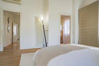 Letto o letti in una camera di Colleoni Apartment with 2 Superb Terraces