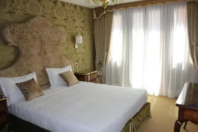 Letto o letti in una camera di Hotel Casanova