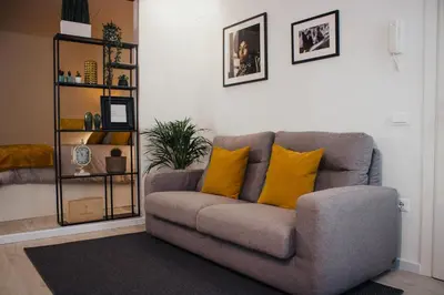 Area soggiorno di BELLINI LIVING APARTMENTS