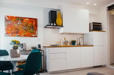 Cucina o angolo cottura di BELLINI LIVING APARTMENTS