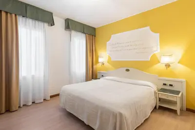 Letto o letti in una camera di Hotel Ca' Tron