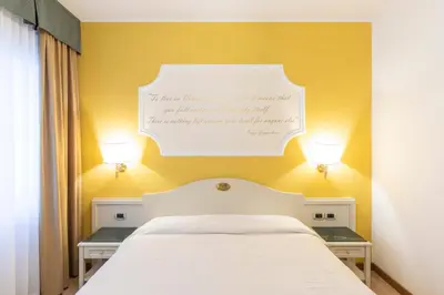 Letto o letti in una camera di Hotel Ca' Tron