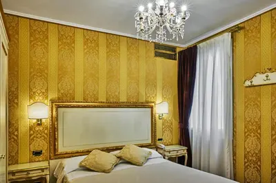 Letto o letti in una camera di Hotel Gardena