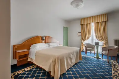 Letto o letti in una camera di Hotel Terme Venezia