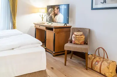 Letto o letti in una camera di All’Angelo Art Hotel