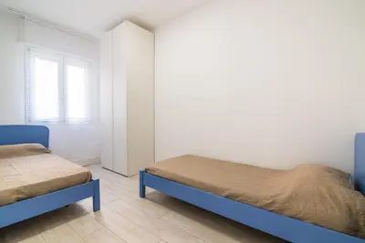 Letto o letti in una camera di [Piazza Mazzini] Appartamento a 2 passi dal mare.